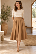 Imagen conceptual de Falda midi camel plisada con bolsillos creada con IA; prenda pendiente de confirmar