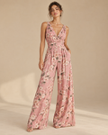 Imagen conceptual de Mono floral rosa de pernera ancha creada con IA; diseño pendiente de confirmar.