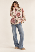 Imagen conceptual generada por IA de jersey de textura esponjosa con dibujo floral; no representa el artículo definitivo
